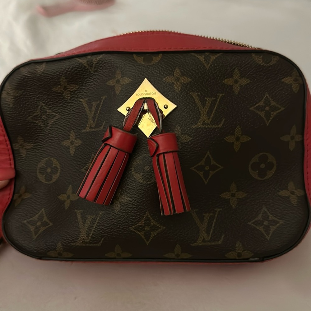 Louis Vuitton logo shoulder bag with red interior and accents